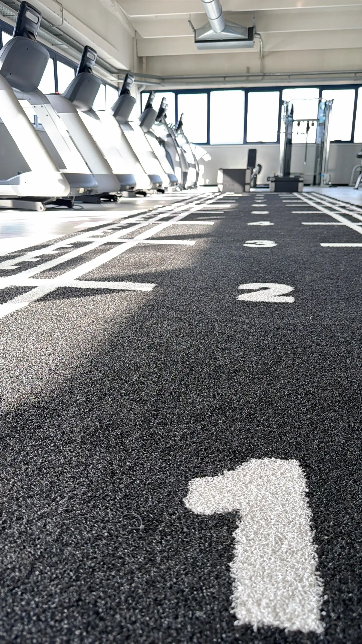 Area funzionale di AS Gym con pista numerata e tapis roulant